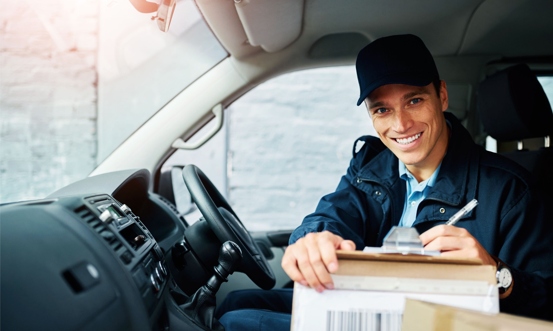 Courier, man and portrait in van with checklist for address verification, shipping records and order tracking. Male employee, clipboard and dispatch details for delivery schedule and confirmation.